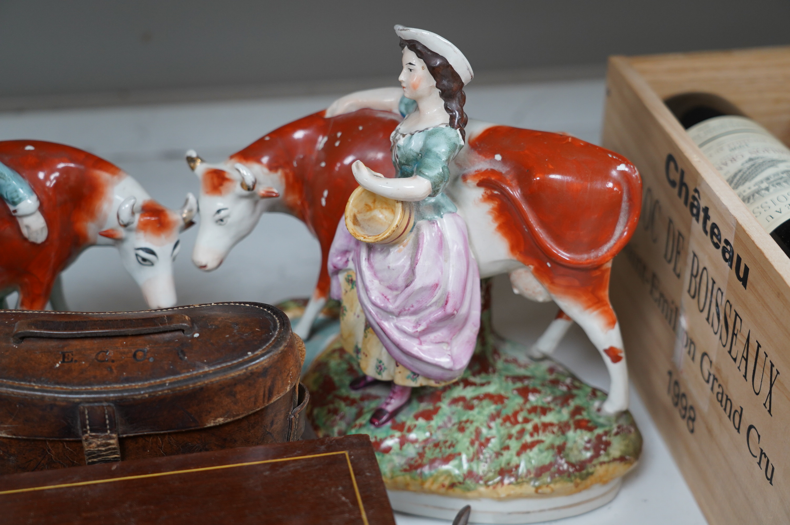 A pair of Staffordshire cow groups, two boxes and a cased pair of binoculars. Condition - fair